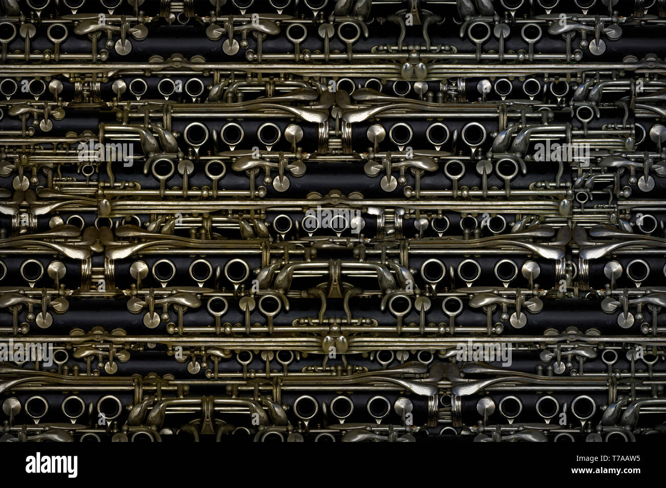 Parts of a clarinet used repeatedly to create a background pattern. Stock Photo