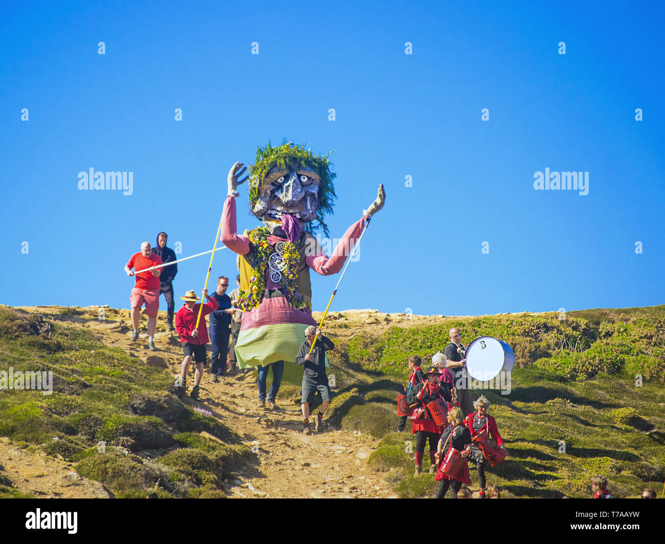 The annual Giant Bolster pageant, held in St Agnes, Cornwall,UK. Every year the villagers of St Agnes re-enact the legend processing the Giant and all Stock Photo