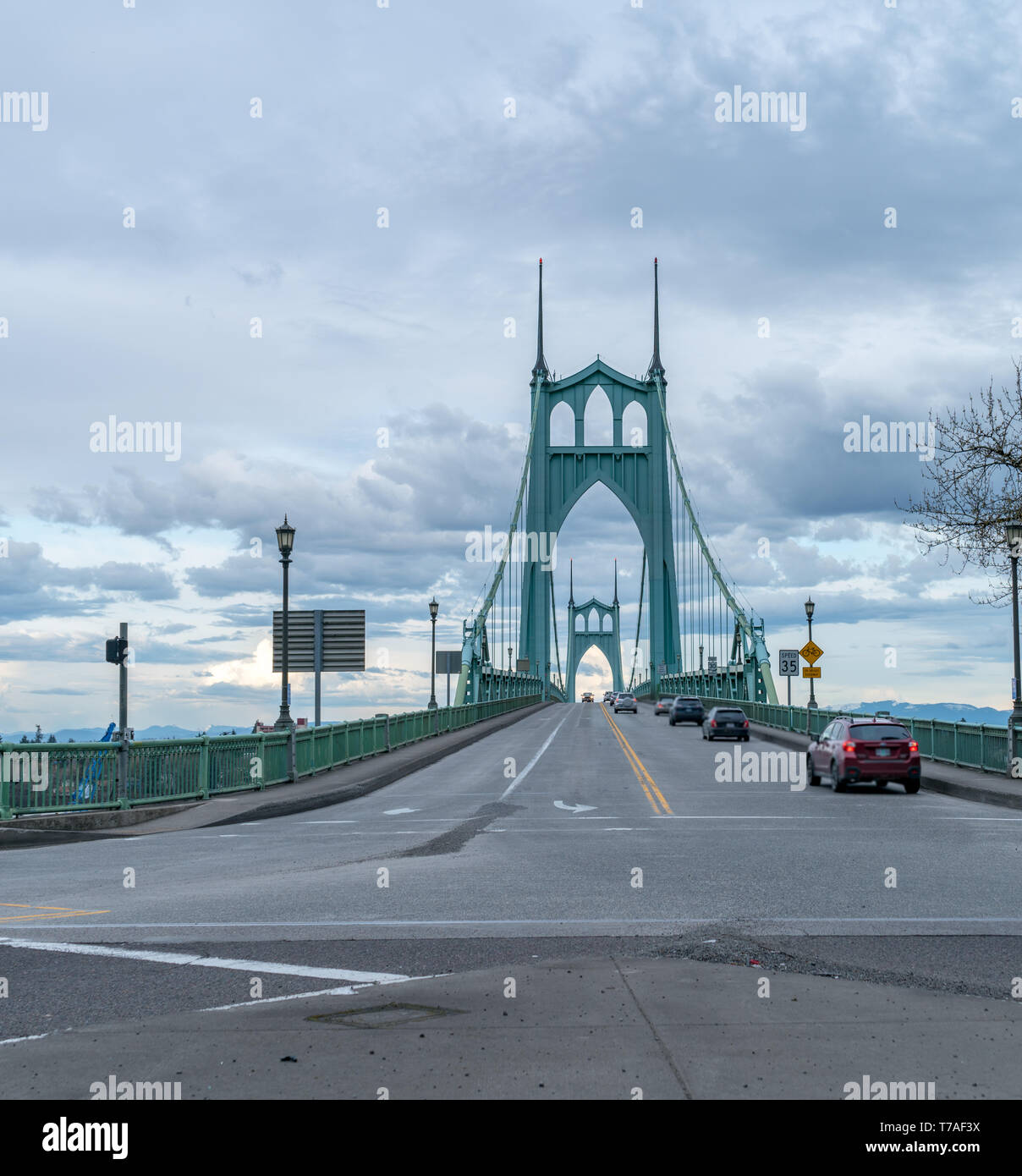 Looking At the Traffic Lanes of St Johns Bridge with Cloudy skies Stock Photo