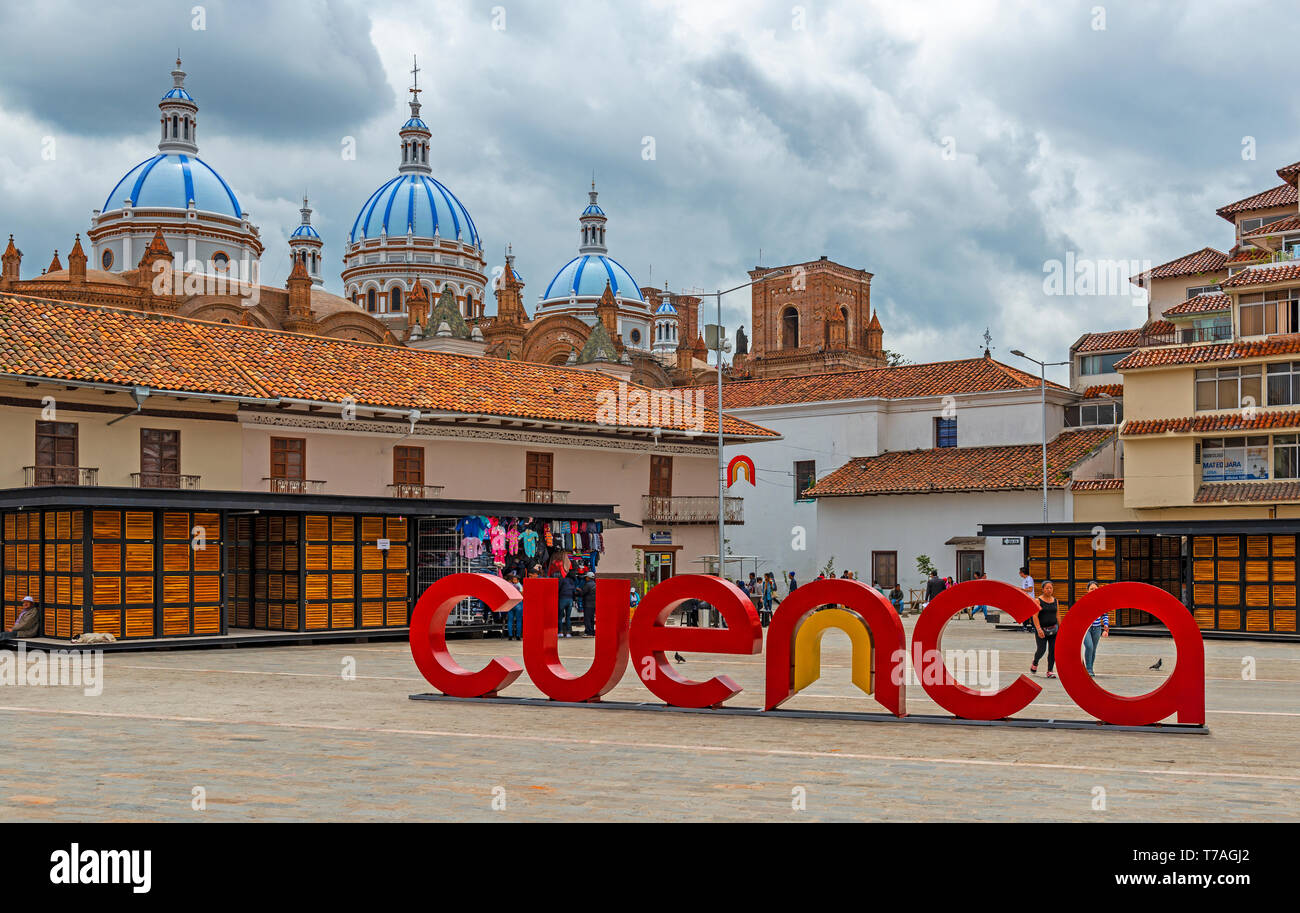 Cityscape with symbol sign of Cuenca city on San Francisco square with the famous domes of the New Cathedral in the background, Cuenca, Ecuador. Stock Photo