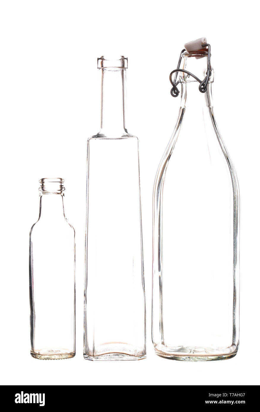 Barely there clear glass bottles, isolated on white background. Stock Photo