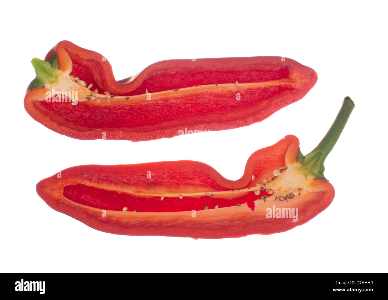 Red Cubanelle sweet pepper isolated on white background. Capsicum annuum.Cut open to reveal inside, seeds. Aka Italian frying pepper. Stock Photo