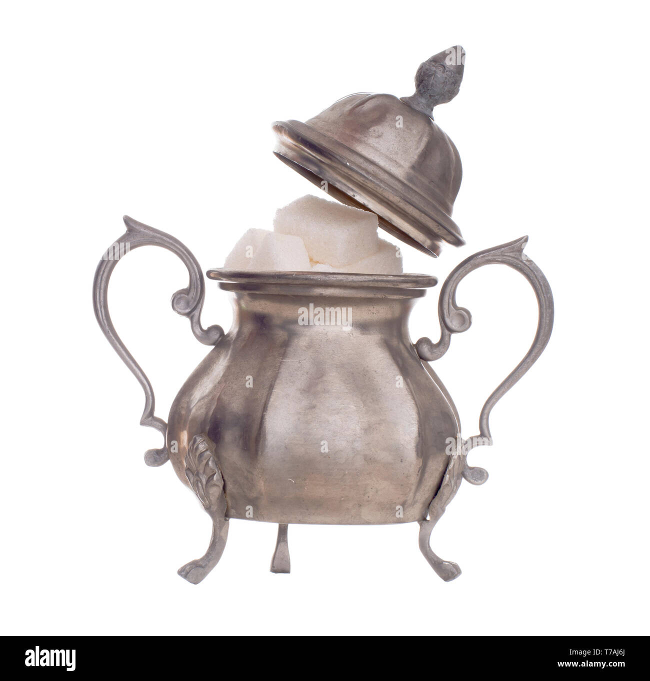Vintage pewter sugar bowl with lid off to show white sugar cubes