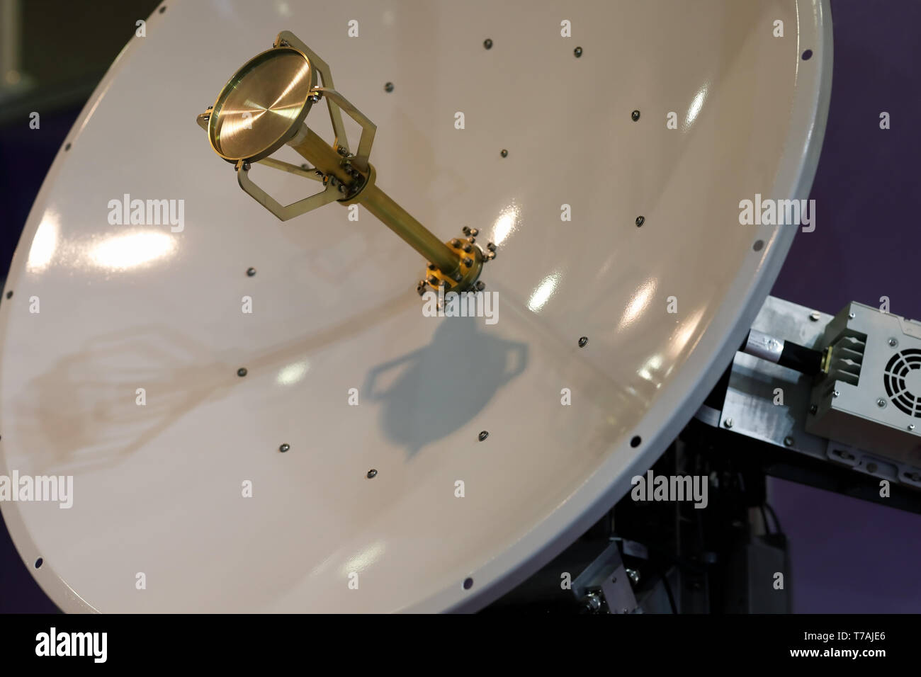 Close up view of the motorised satellite dish antenna. Selective focus. Stock Photo