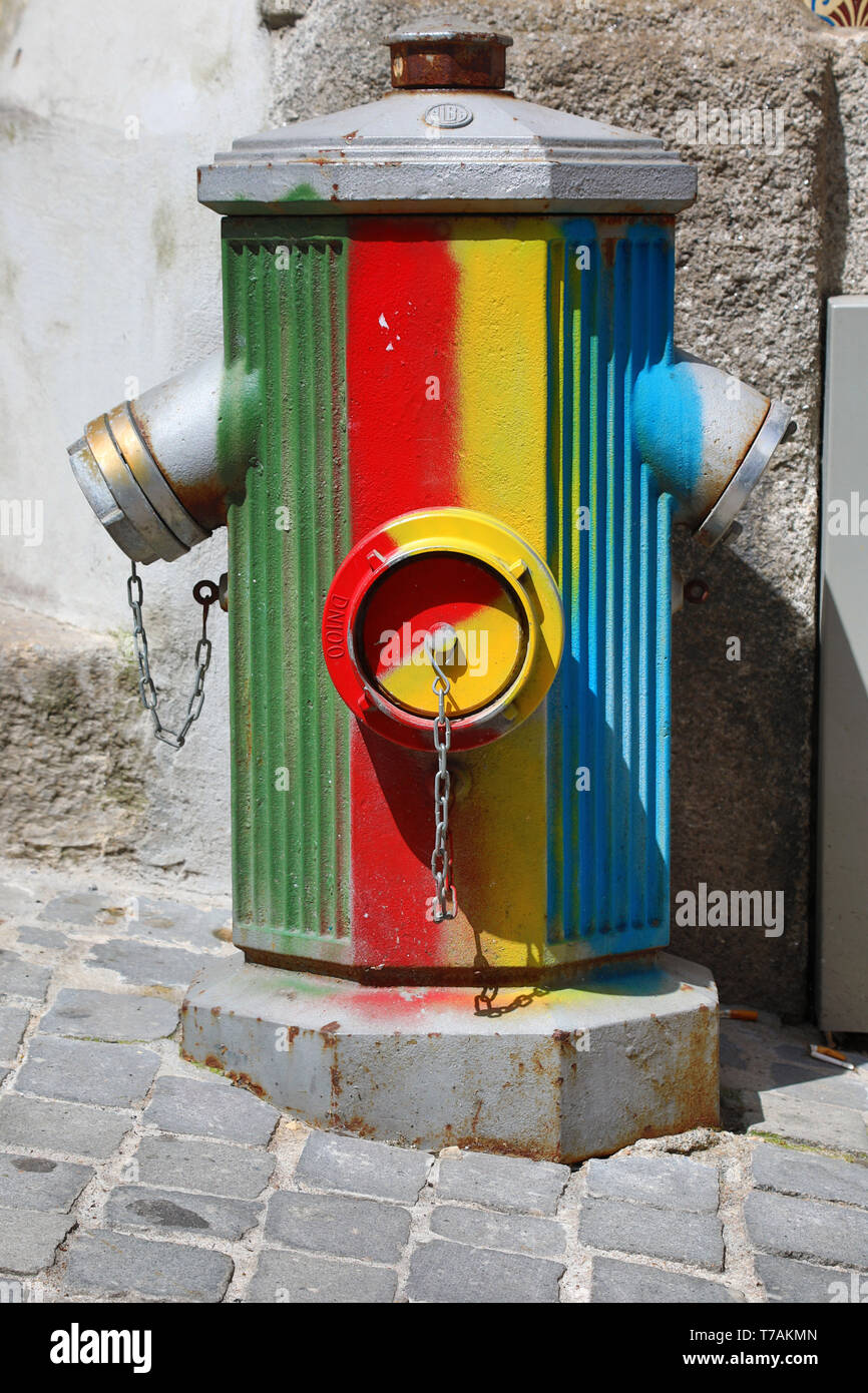 Multi-coloured fire hydrant in Porto, Portugal Stock Photo