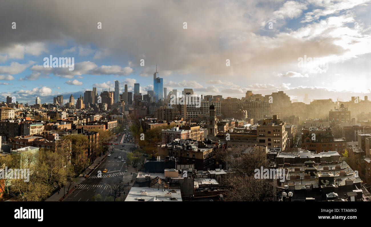 A panoramic sunset of Downtown Manhattan, New York City, which includes the World Trade Center (the Freedom Tower). Taken in Greenwich Village. Stock Photo