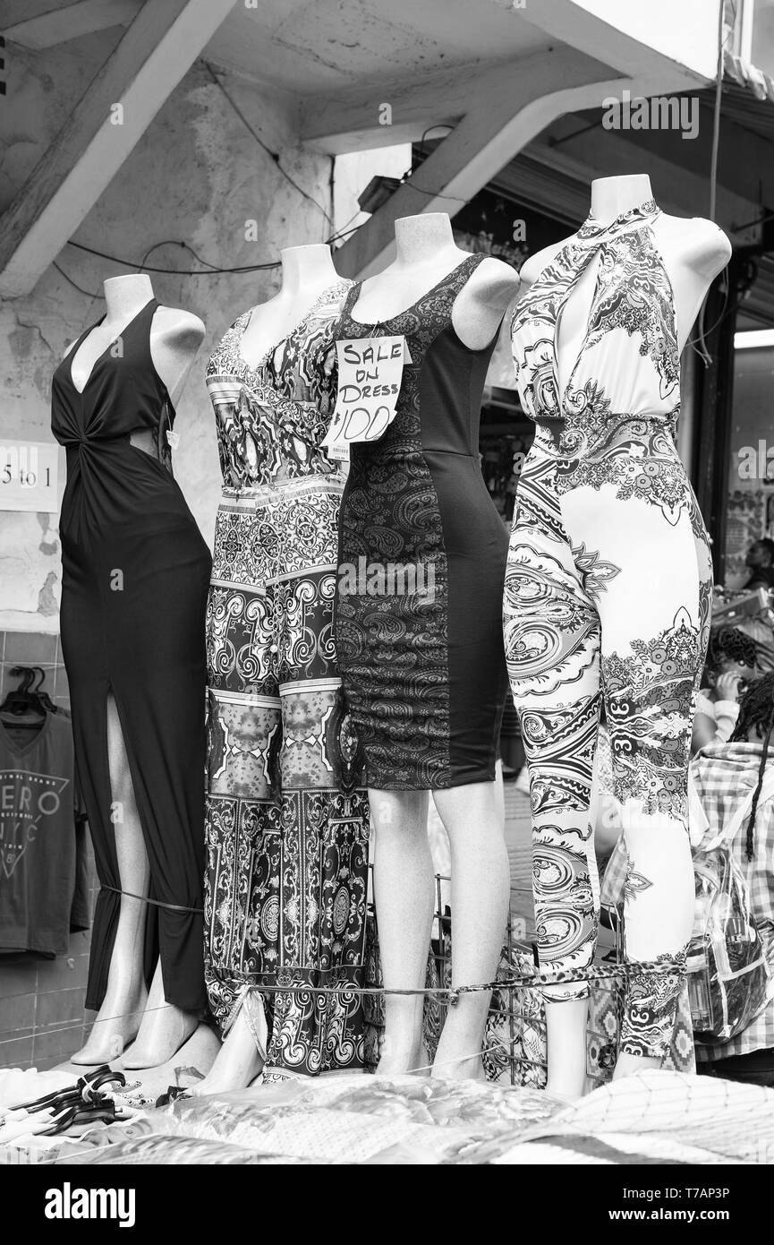 Female dresses on sale displayed on fashion dummies outdoors on market or  street shop Stock Photo - Alamy