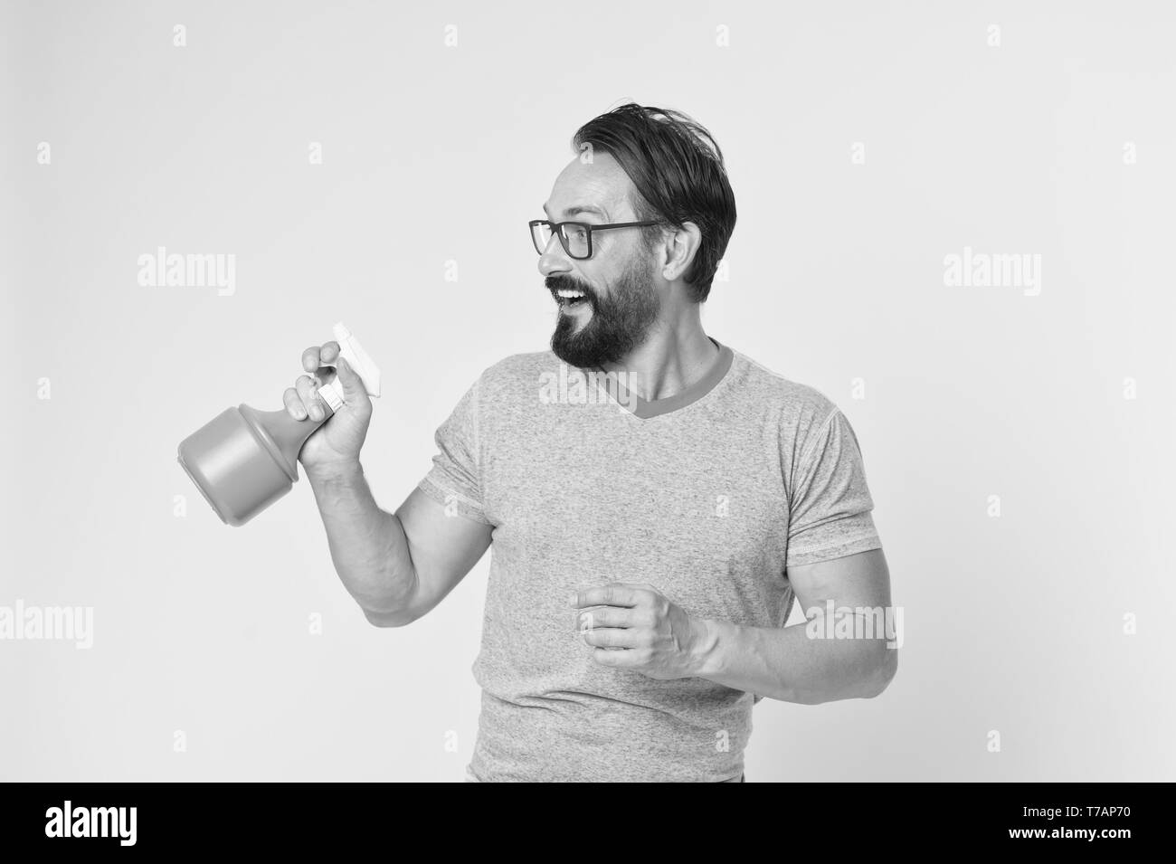 Bearded man with eyeglasses refresh sprinkling water. Man refresh with ...