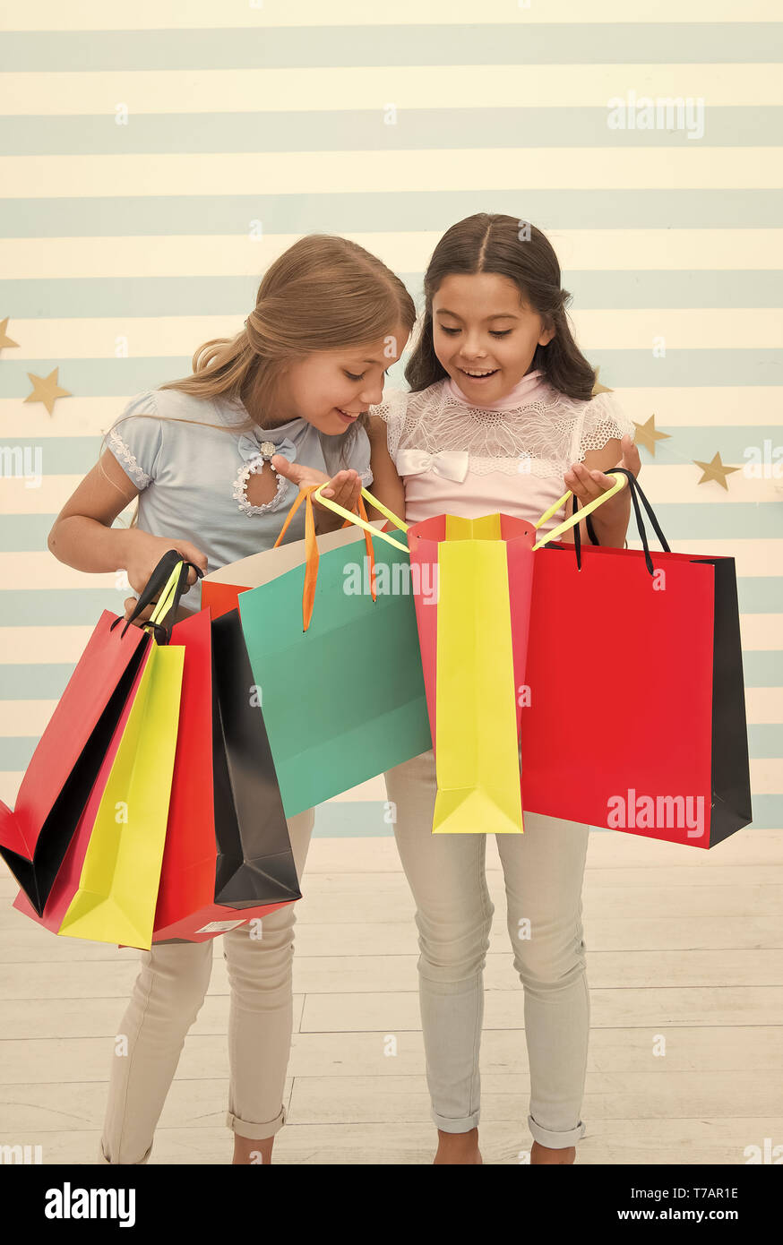 Black Friday At School Market Happy Small Kids Girls With Shopping Bags After Black Friday Sale Small Kids With Purchase From School Market Go Shopping Best Discounts And Promo Codes Stock Photo