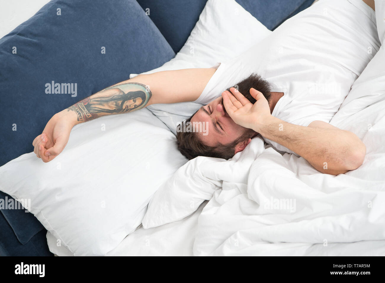 Relax and sleep concept. Man bearded guy sleep on white sheets. Healthy ...