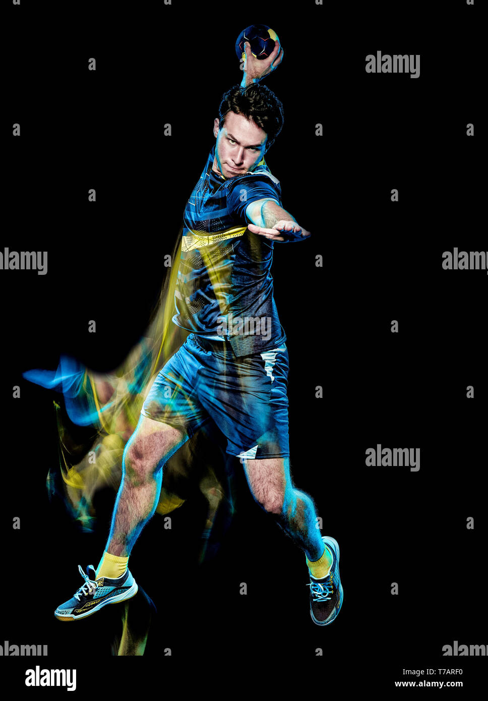 one caucasian handball player young man isolated on black background with speed light painting effect motion blur Stock Photo