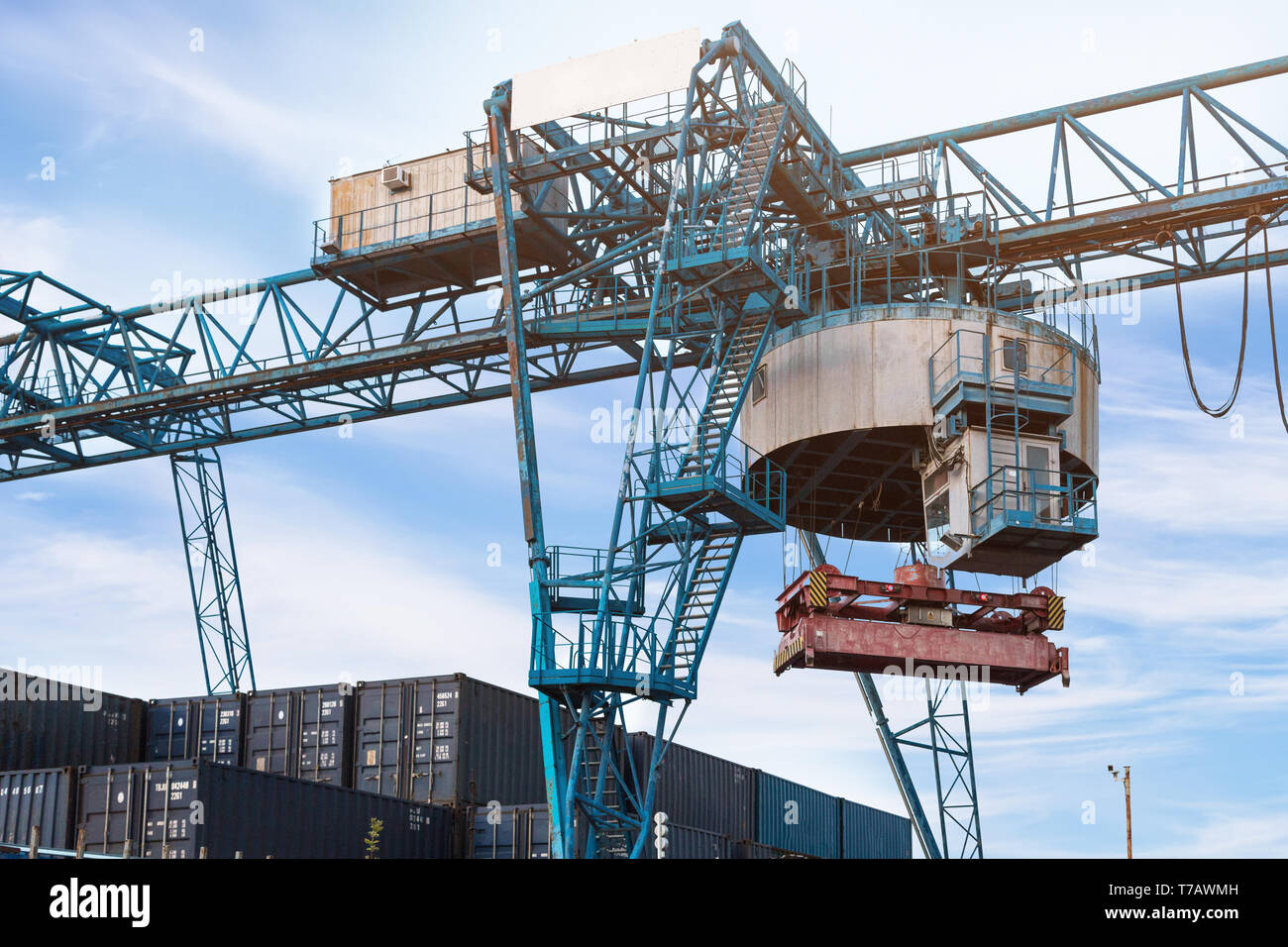 Large port crane unloads cargo containers Stock Photo - Alamy