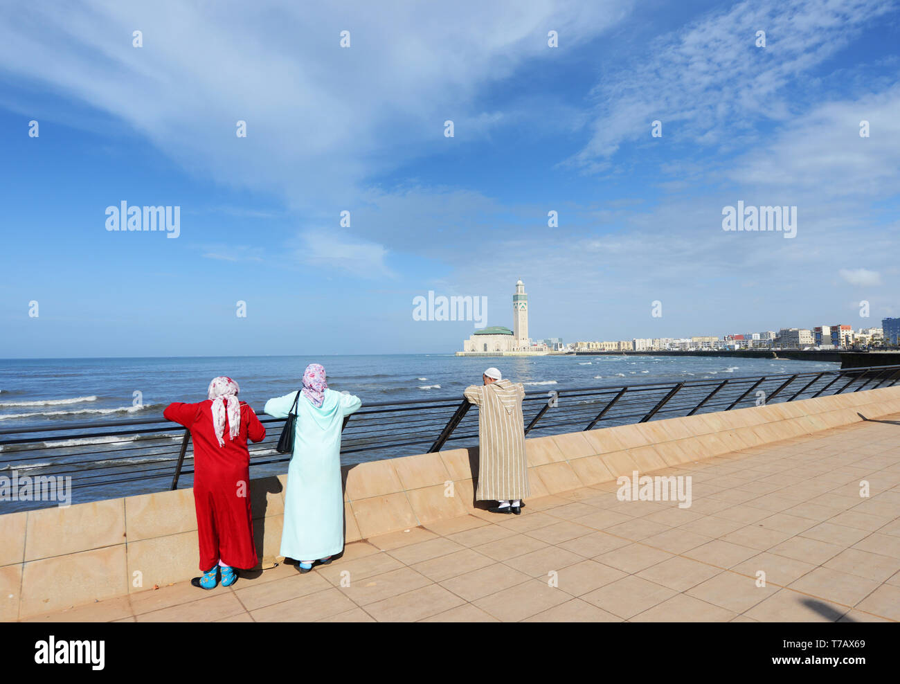 Local Moroccans enjoying the view of the Hassan II mosque in Casablanca. Stock Photo