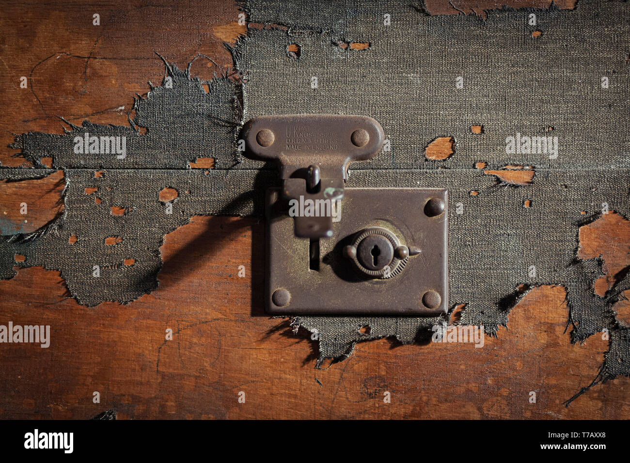 Old vintage traveling suitcase with the lock mechanism unlocked Stock