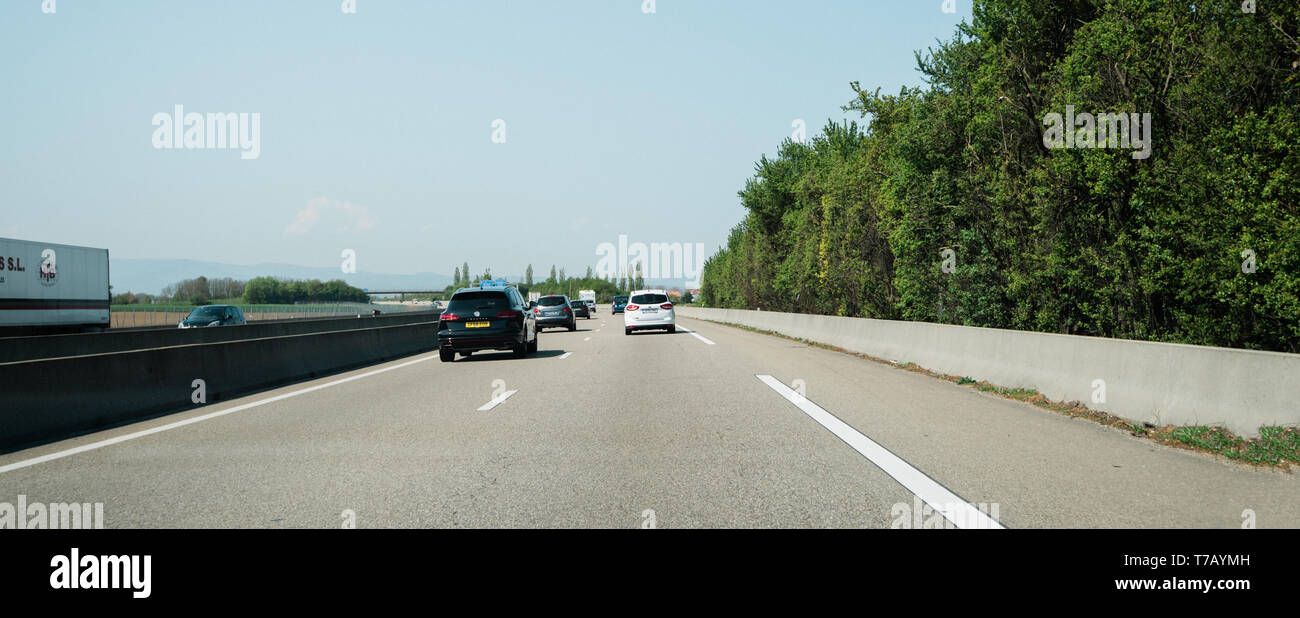 France - Apr 19, 2019: Light traffic on French highway perspective view at the long autoroute to French Vosges mountains Stock Photo