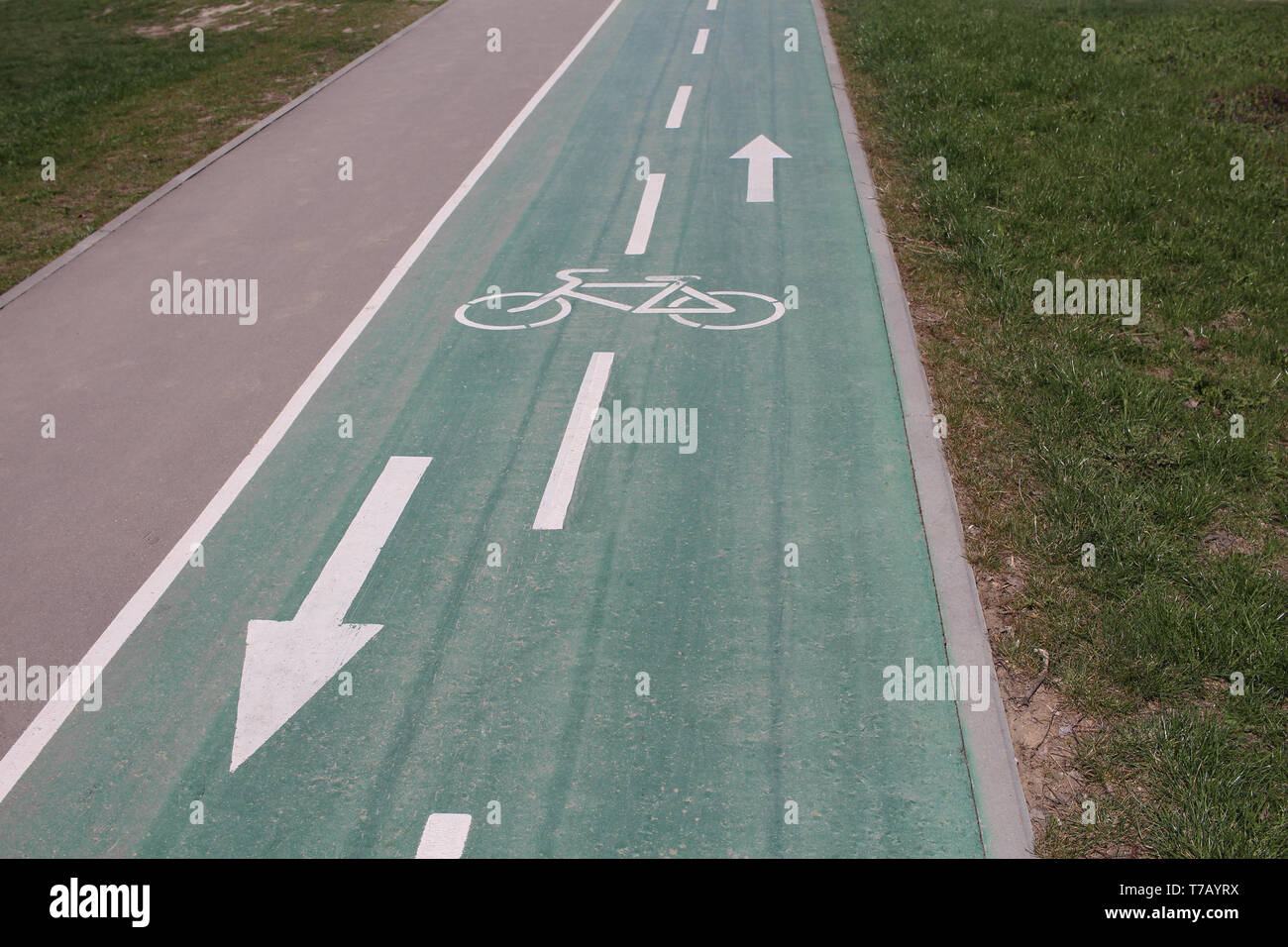Bicycle road. Dedicated road for bicycles. There are arrows on the road. There are no people. Stock Photo