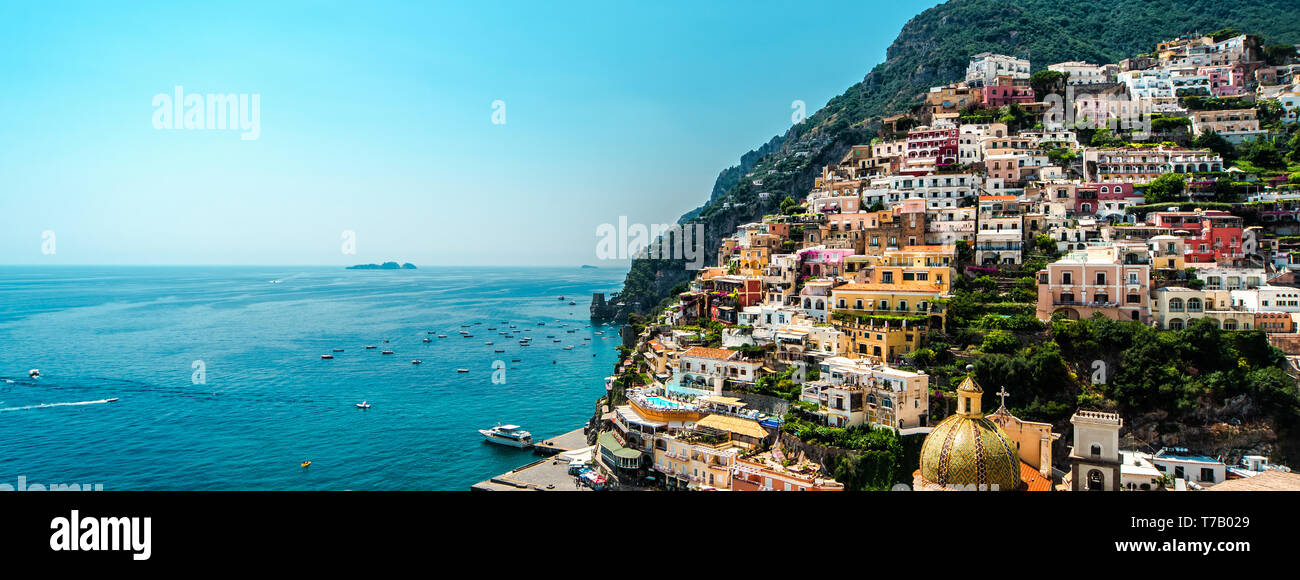 Sunny day in amazing Amalfi coast panoramic view, colorful hillside houses on the mountain, blue Mediterranean Sea famous tourist resort Positano Stock Photo
