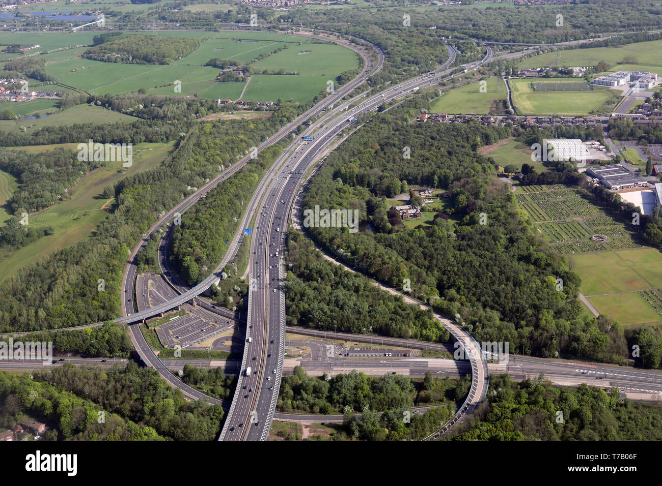 aerial view of the M60 motorway at J14 with A580 road, the Wardley Park & Ride, looking north towards the M61. Worsley, Manchester Stock Photo