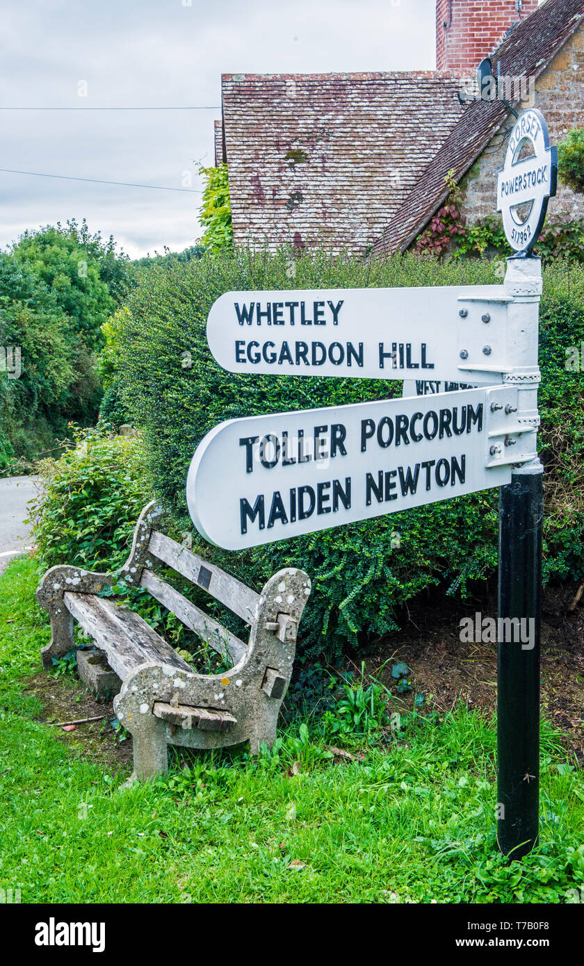 Village Direction signpost at Powerstock Village in Dorset England. Stock Photo