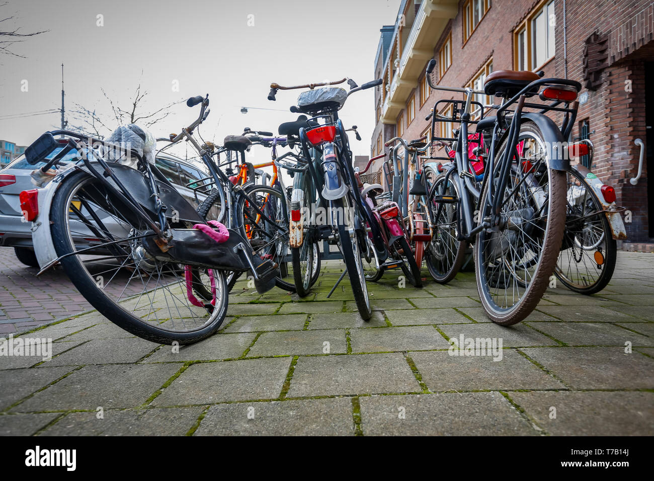 chaotically parked abandoned bicycles on the streets of the Netherlands Stock Photo