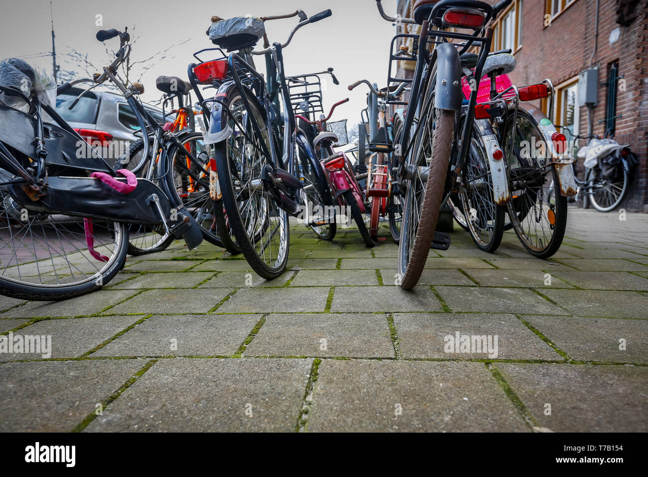 chaotically parked abandoned bicycles on the streets of the Netherlands Stock Photo
