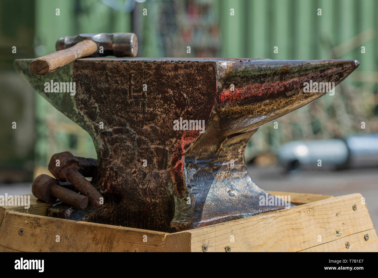 Blacksmith old beaten anvil and hammer Stock Photo