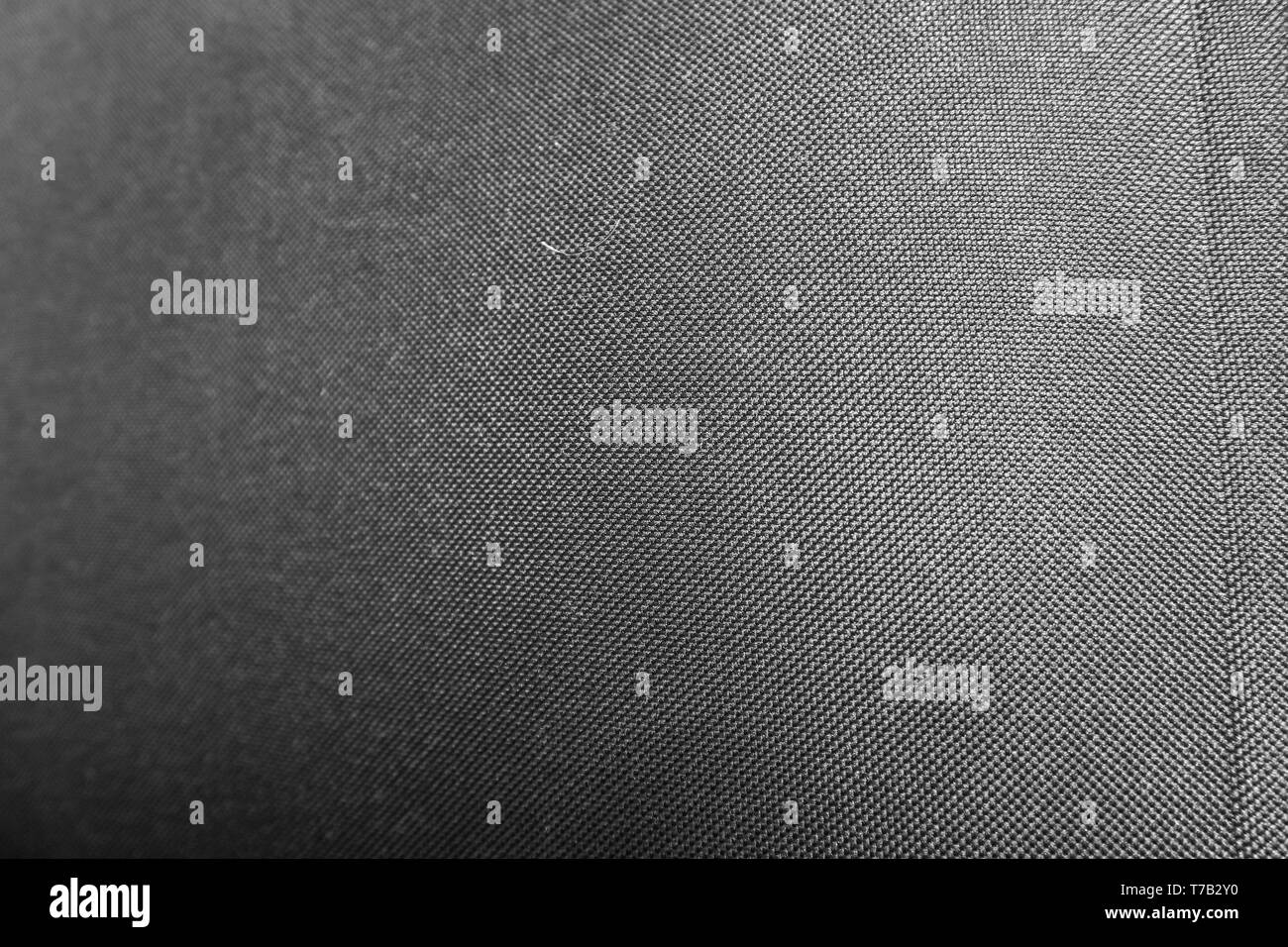 Fabric texture. Grunge background. Abstract halftone vector illustration. Overlay to create interesting effect and depth. Black isolated on white. Stock Photo