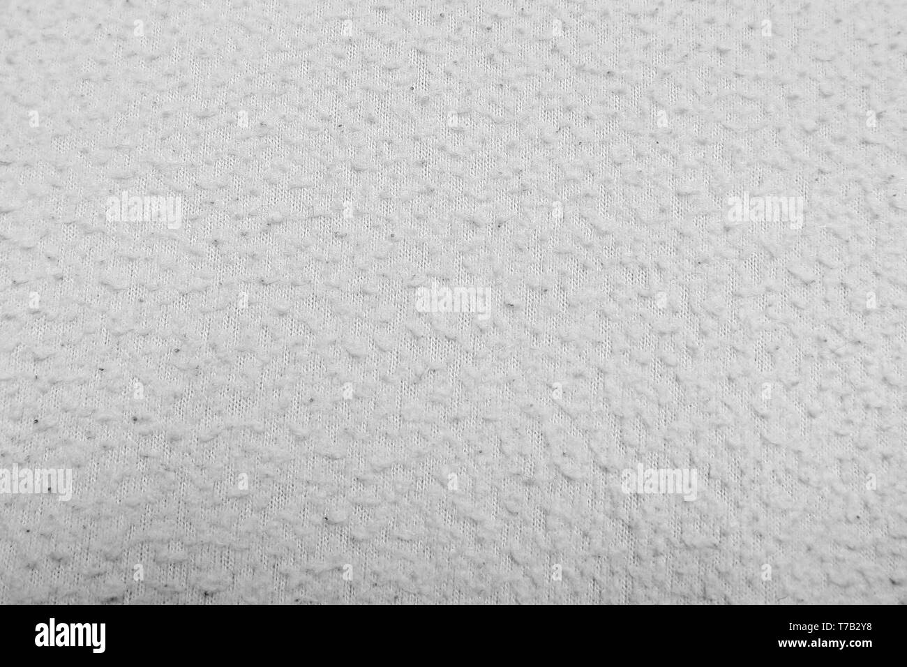 Fabric texture. Grunge background. Abstract halftone vector illustration. Overlay to create interesting effect and depth. Black isolated on white. Stock Photo