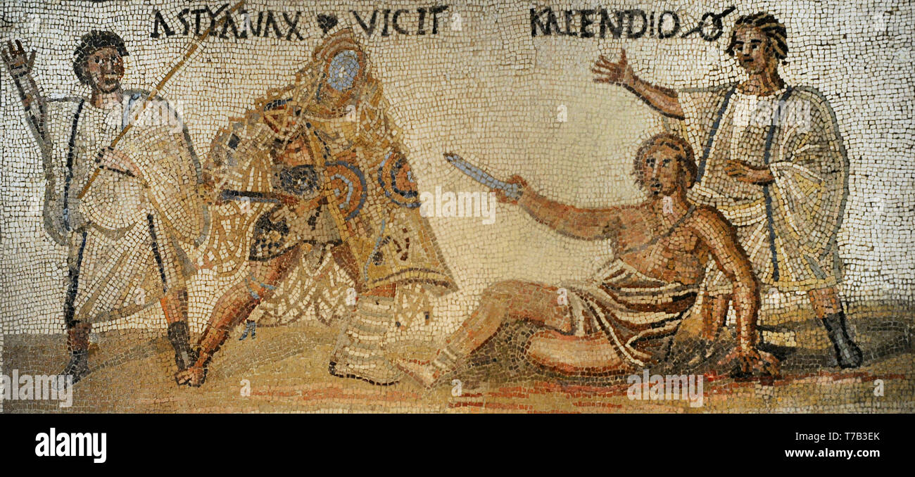 Roman mosaic. Limestones. Secutor versus retiarius. Depiction of the mortal combat between the secutor Astyanax and the retiarius Kalendio. The lanista (gladiator trainer) encourages the combat. Astyanax was the winner (the inscription VICIT appears beside Astyanax). Detail of the scene from the upper half of the mosaic. 3rd century AD. From Rome (Italy). National Archaeological Museum. Madrid. Spain. Stock Photo