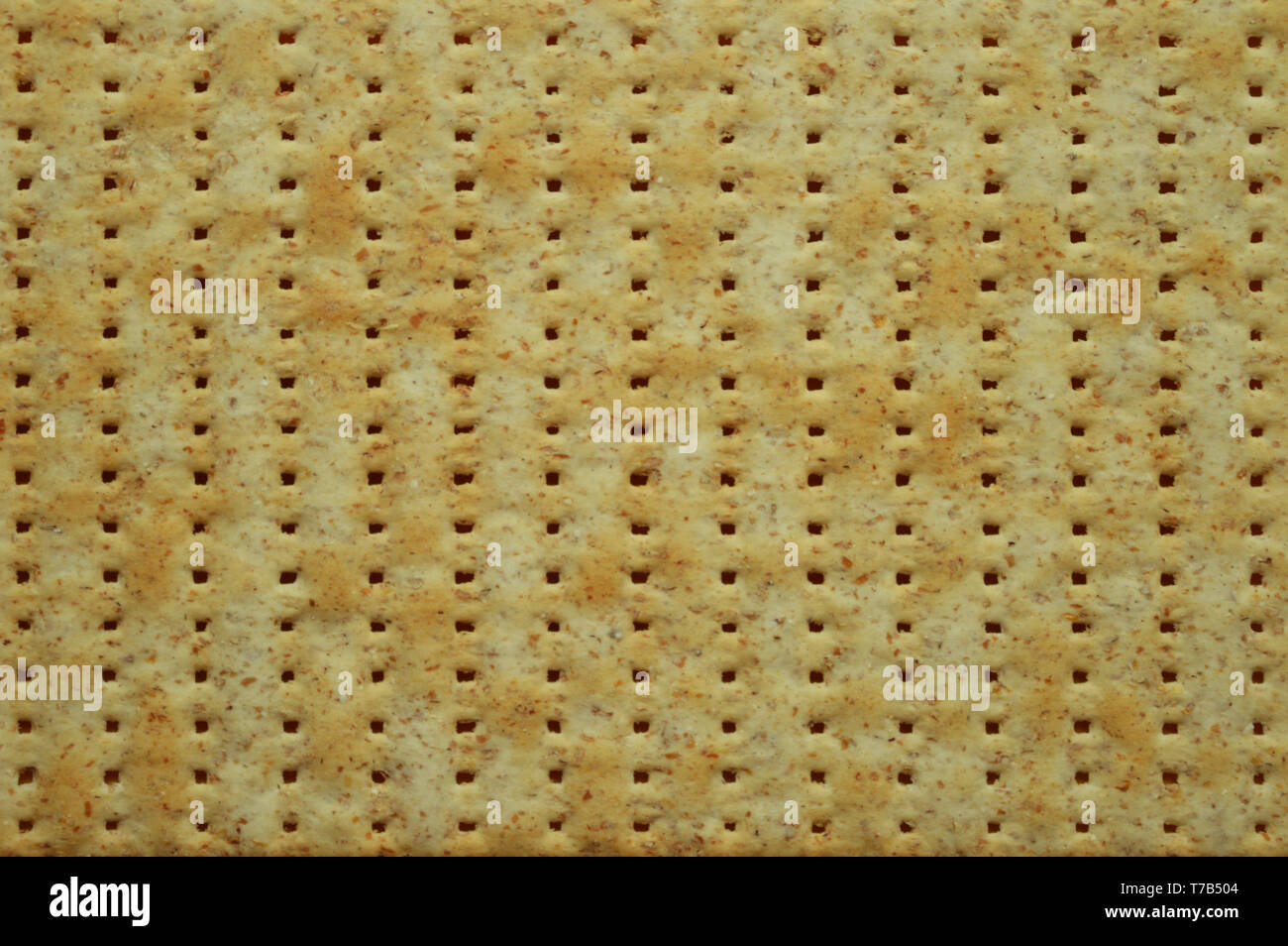 Top view of jewish flatbread matzo like a background. Trendy texture. Food concept. Stock Photo