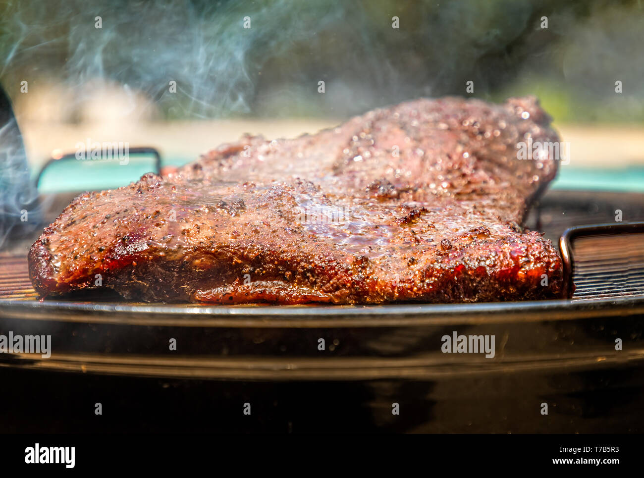 Smoked Texan Brisket on the bbq grill Stock Photo