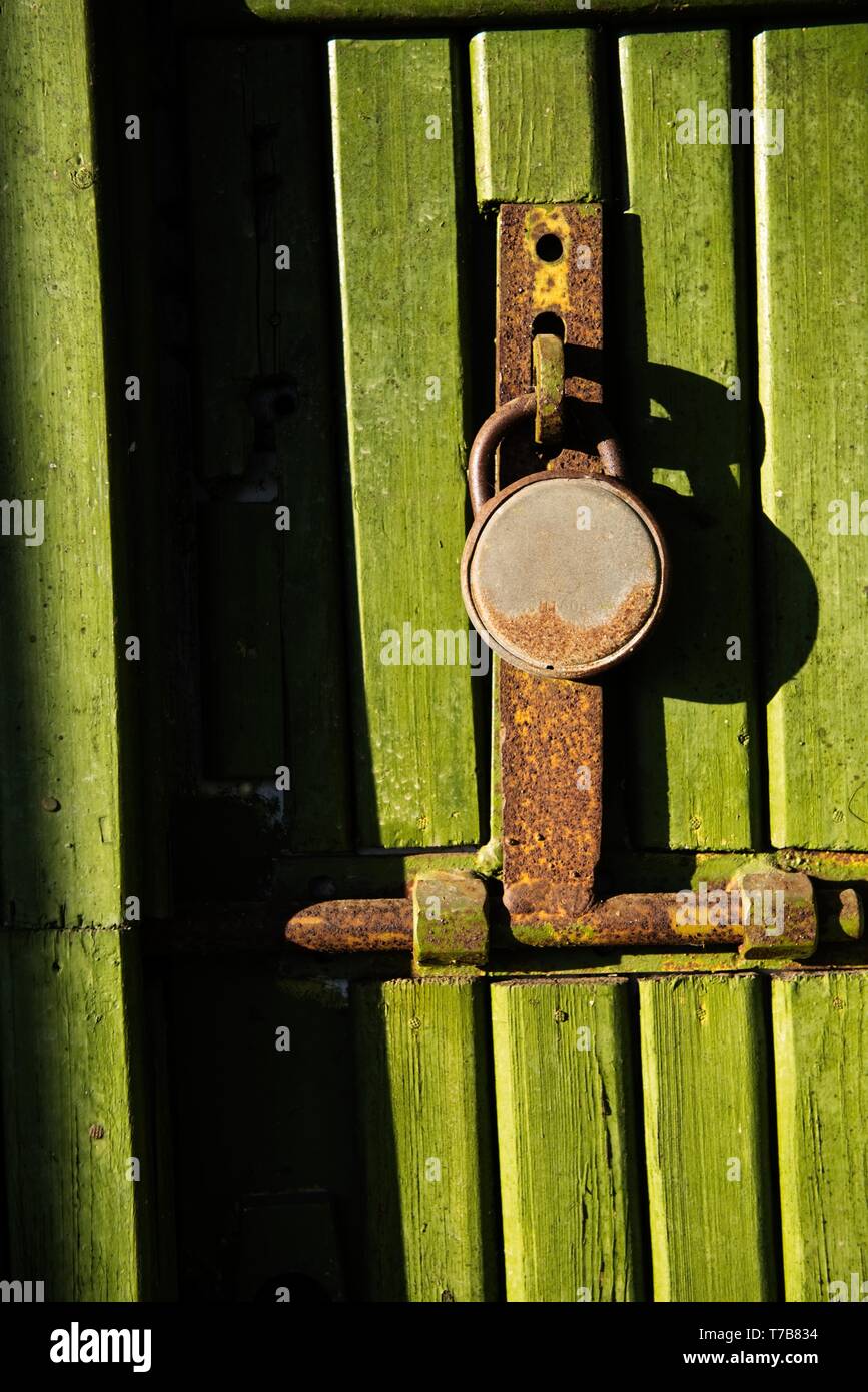 Green wooden door with key lock Stock Photo Alamy