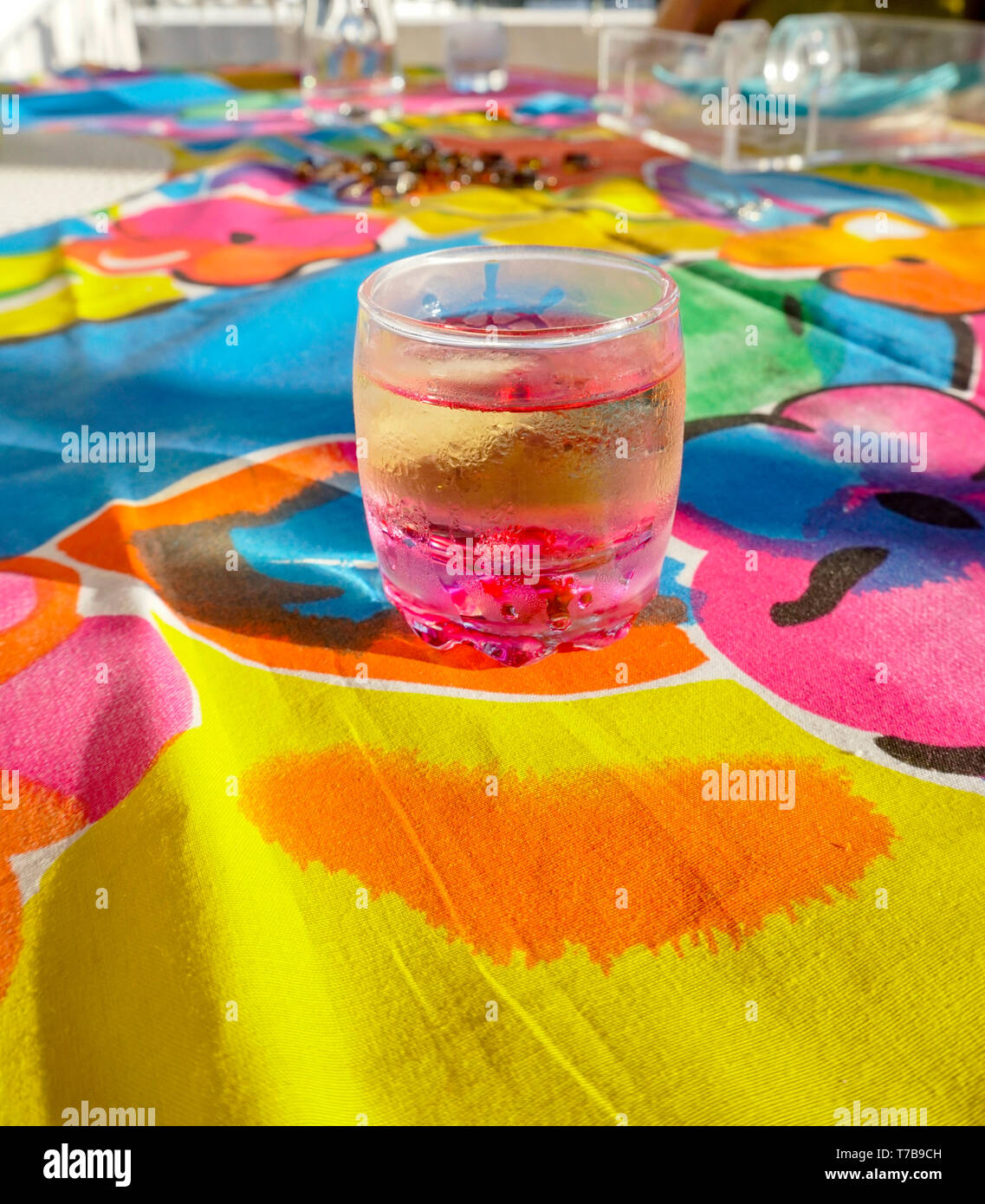 shot glass of alcohol on Marimekko tablecloth Stock Photo