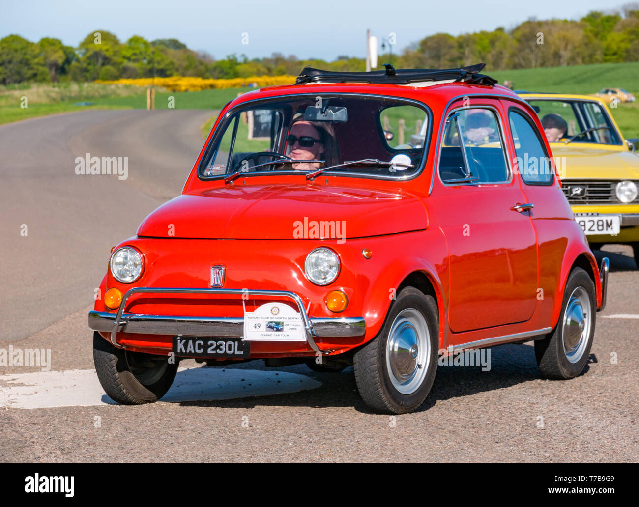 Classic vintage 1972 orange Fiat 500 arriving at Archerfield Estate, North Berwick Rotary Club Classic Car Tour 2019, East Lothian, Scotland, UK Stock Photo