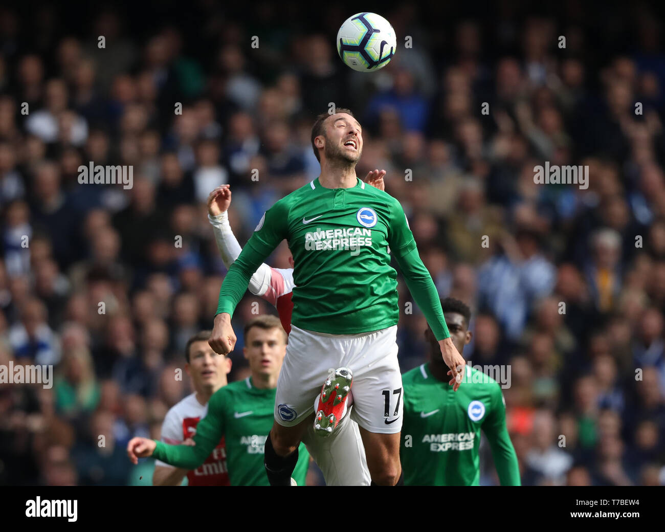 London, UK. 05th May, 2019. Glenn Murphy (B&HA) has a boot appear between his legs at the Arsenal v Brighton and Hove Albion English Premier League football match at The Emirates Stadium, London, UK on May 5, 2019. **Editorial use only, license required for commercial use. No use in betting, games or a single club/league/player publications** Credit: Paul Marriott/Alamy Live News Stock Photo