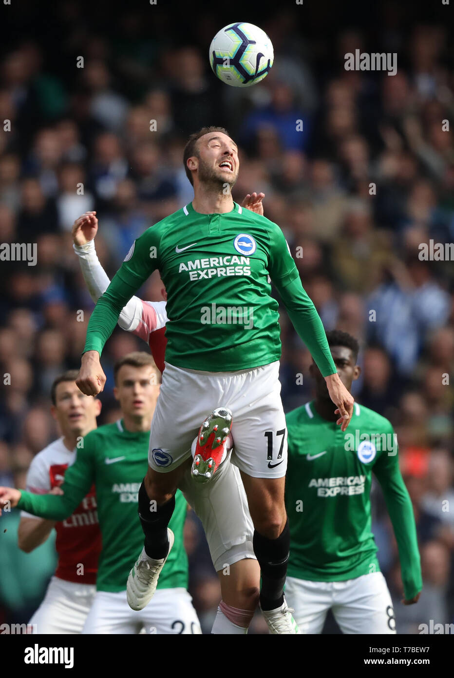 London, UK. 05th May, 2019. Glenn Murphy (B&HA) has a boot appear between his legs at the Arsenal v Brighton and Hove Albion English Premier League football match at The Emirates Stadium, London, UK on May 5, 2019. **Editorial use only, license required for commercial use. No use in betting, games or a single club/league/player publications** Credit: Paul Marriott/Alamy Live News Stock Photo