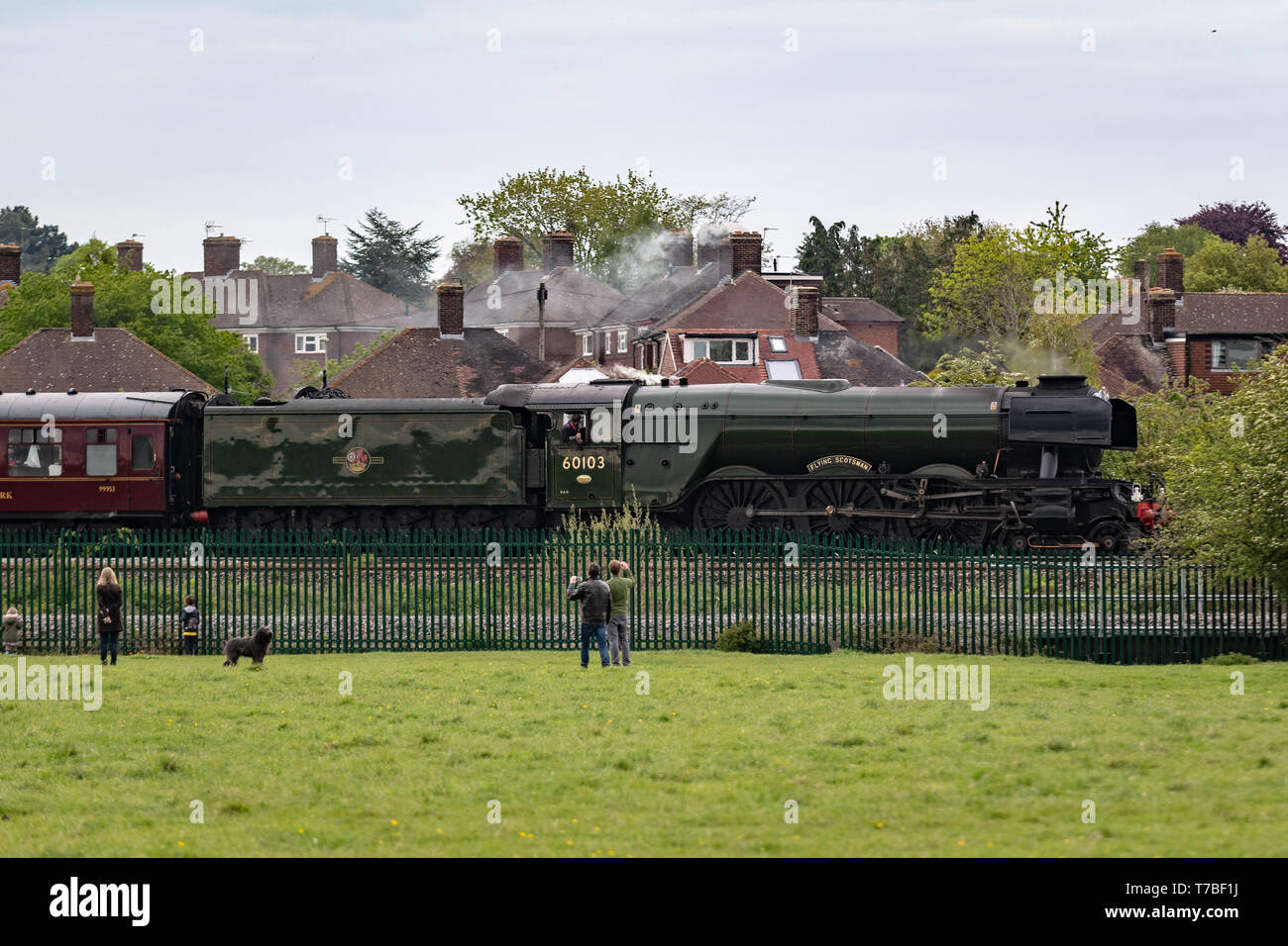 Oxford, Oxfordshire, UK. 5 May, 2019. The famous Flying Scotsman, Engine Number 60103, crosses alongside Port Meadow in Oxford Sunday evening. The train was delayed due to a broken rail and onlookers on the tracks. Credit: Sidney Bruere/Alamy Live News Stock Photo