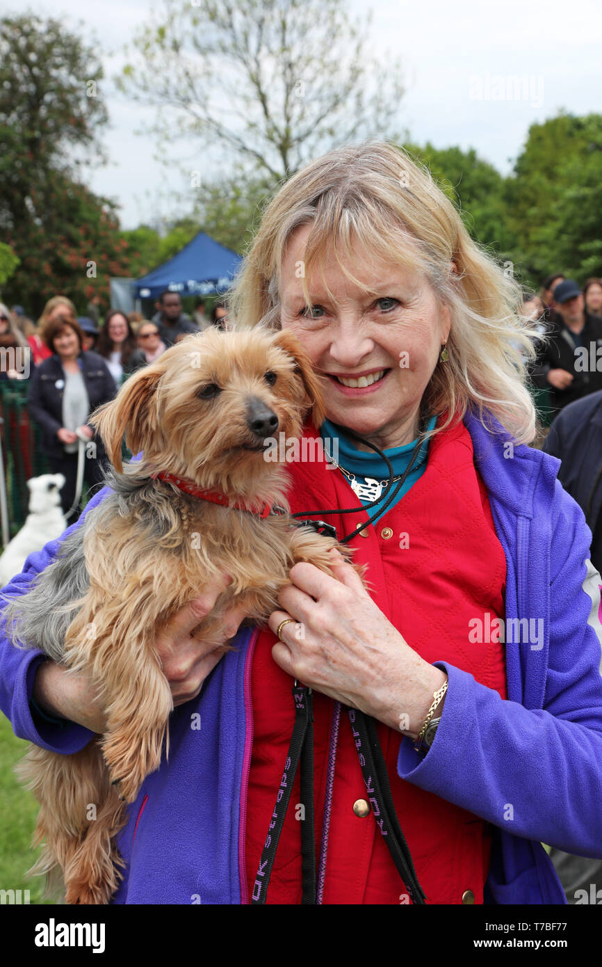 London, UK. 5th May 2019. Judge Liza Goddard with her Yorkshire Terrier, Violet, at the All Dogs Matter Bark Off charity dog show, Hampstead Heath, London, England. Cute dogs took part in several categories of this annual dog show which is run by the charity which houses and rehomes dogs in London and finds homes for dogs from overseas. Dogs competed to be cutest pup, best rescue and more. More information at www.alldogsmatter.co.uk Credit: Paul Brown/Alamy Live News Stock Photo
