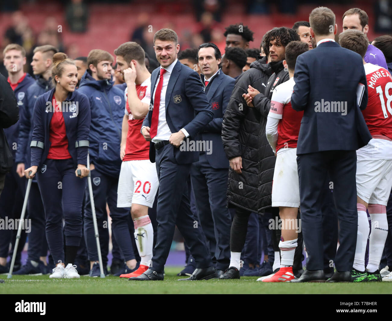 London, UK. 05th May, 2019. An emotional Aaron Ramsey (A) with Unai Emery (Arsenal manager) behind, walks round to thank the fans, as he leaves Arsenal for Juventus at the end of the season, at the Arsenal v Brighton and Hove Albion English Premier League football match at The Emirates Stadium, London, UK on May 5, 2019. **Editorial use only, license required for commercial use. No use in betting, games or a single club/league/player publications** Credit: Paul Marriott/Alamy Live News Stock Photo