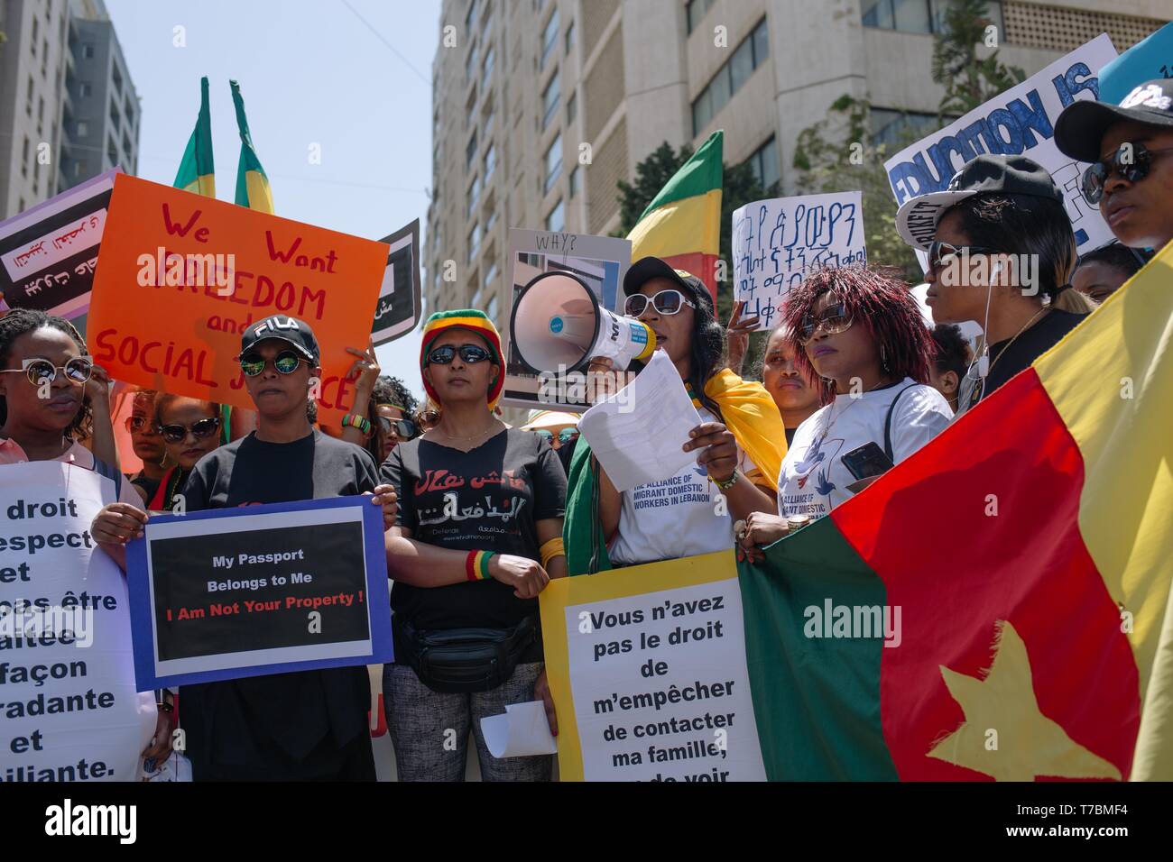 Protesters are seen holding placards during the demonstration. Hundreds of people from different nationalities marched to protest for the rights of migrant workers, shouting slogans and holding banners calling for the abolishment of Lebanon’s controversial kafala sponsorship system. Stock Photo