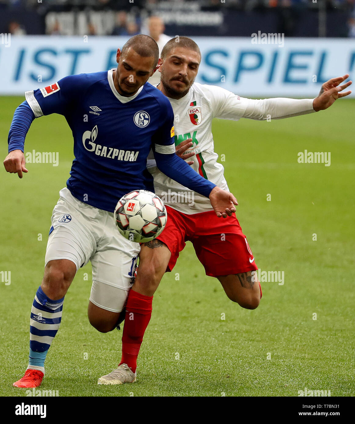 Gelsenkirchen Germany 5th May 2019 Konstantinos Stafylidis R Of Augsburg Vies With Achmed Kutucu Of Schalke 04 During The Bundesliga Match Between Fc Schalke 04 And Fc Augsburg In Gelsenkirchen Germany May