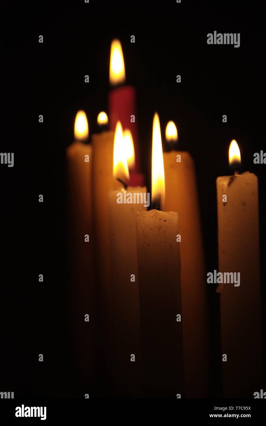 Candles flame close up on a black background Stock Photo - Alamy