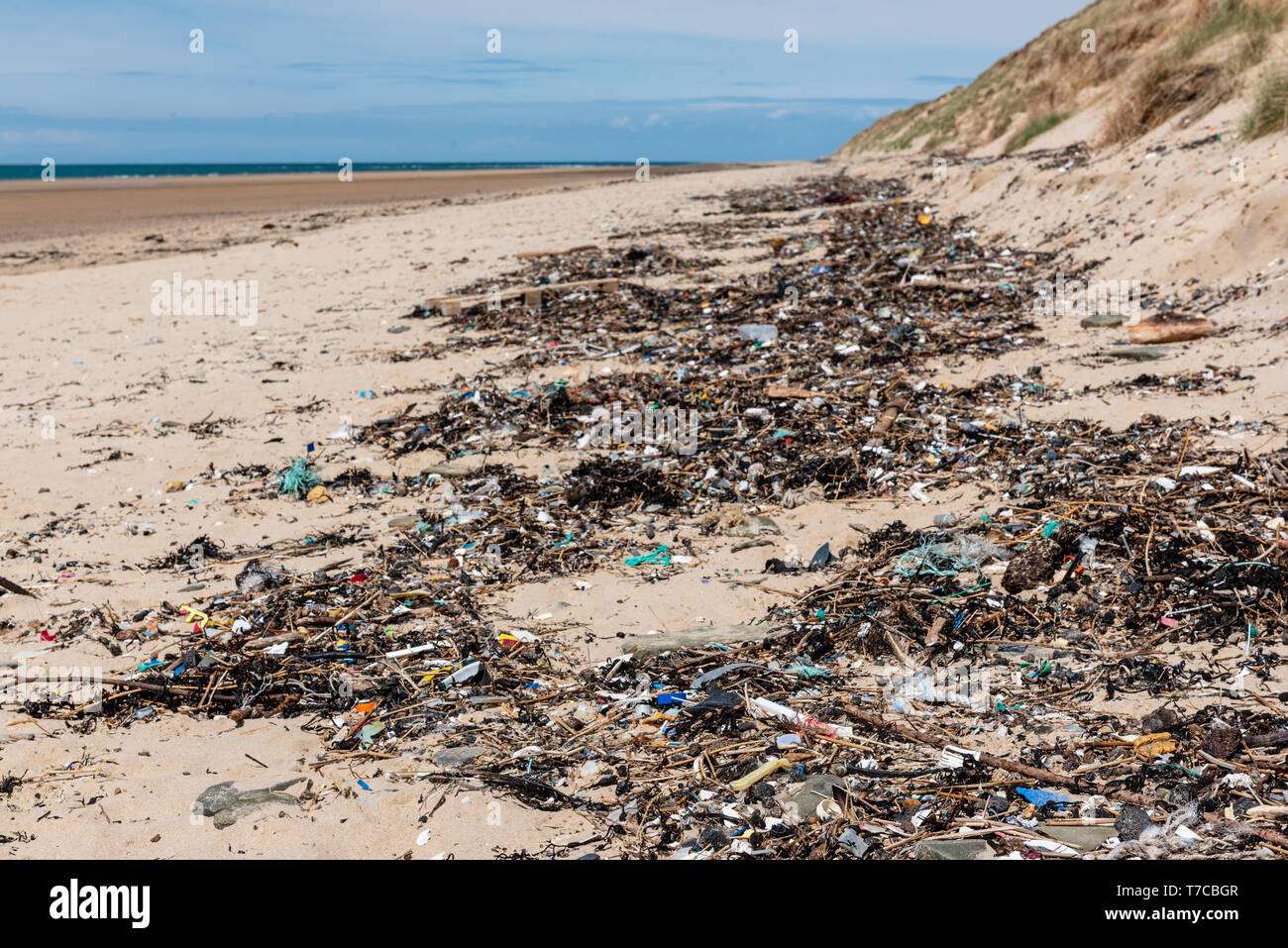 Plastic waste washed up on a beach Stock Photo - Alamy