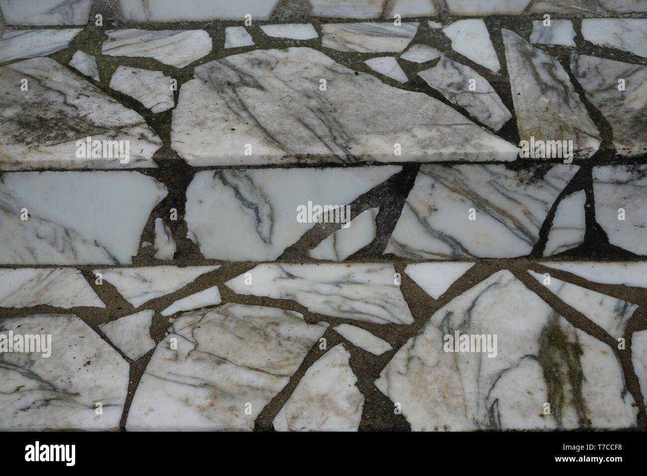 close up of a marble tile mosaic pieces stairway Stock Photo