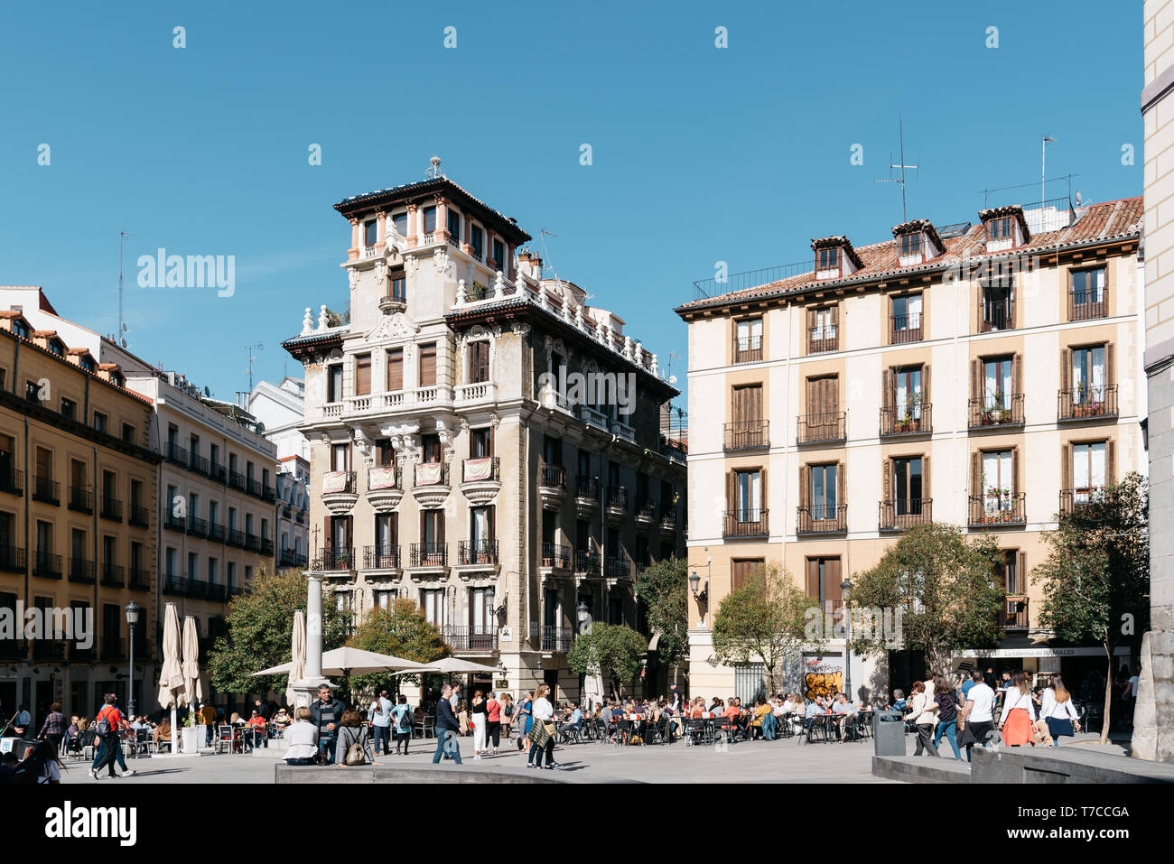 Madrid, Spain - April 14, 2019: People enjoying in Ramales Square in historic city centre. The Quarter of Madrid of the Austrians Stock Photo