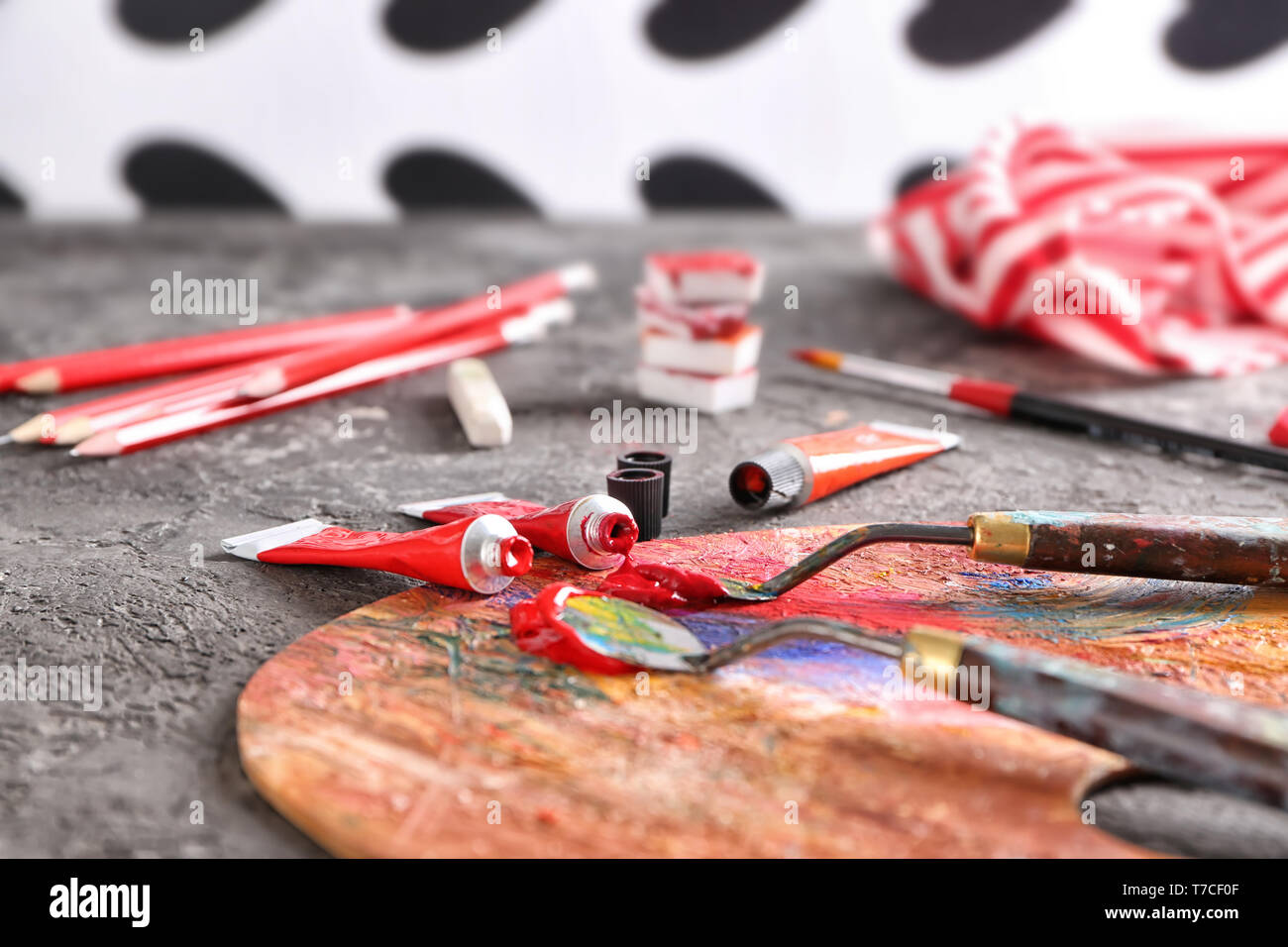 Artist's tools with paints and palette on table Stock Photo - Alamy