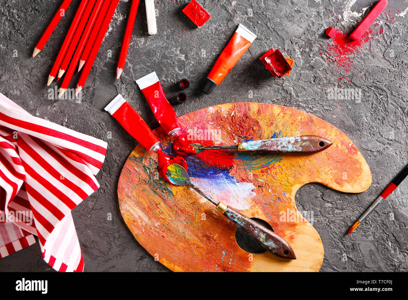 Artist's tools with paints and palette on table Stock Photo - Alamy
