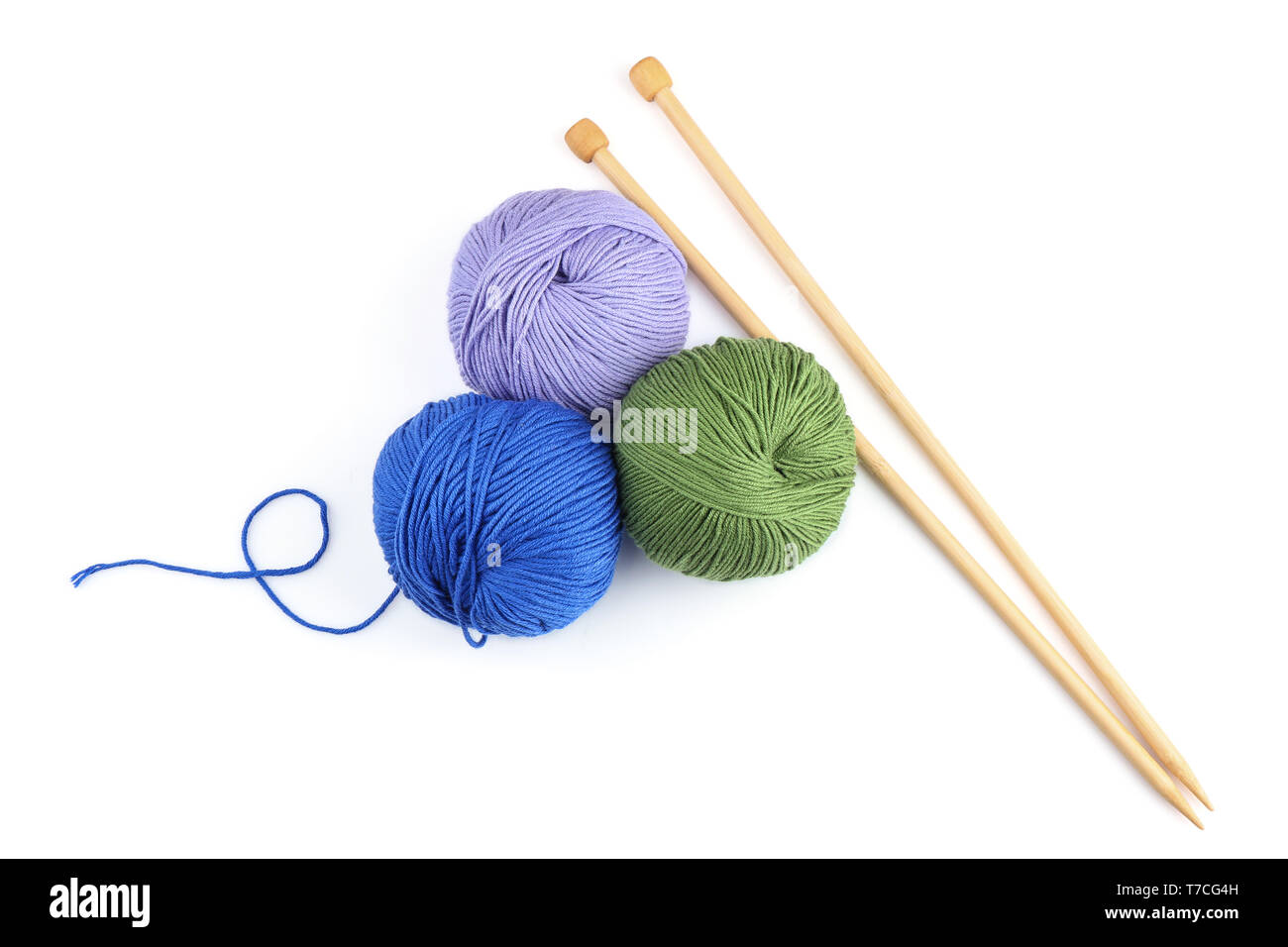 Knitting yarn with needles on white background Stock Photo - Alamy
