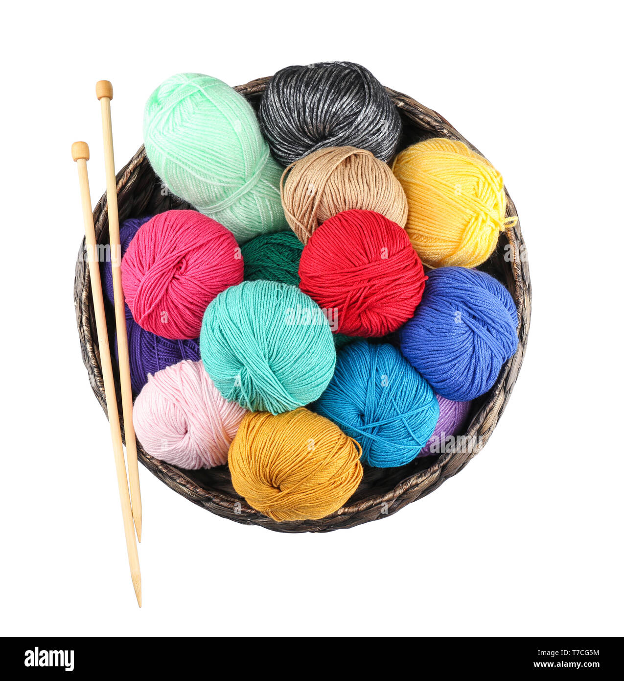 Wicker basket with balls of knitting yarn on white background Stock ...