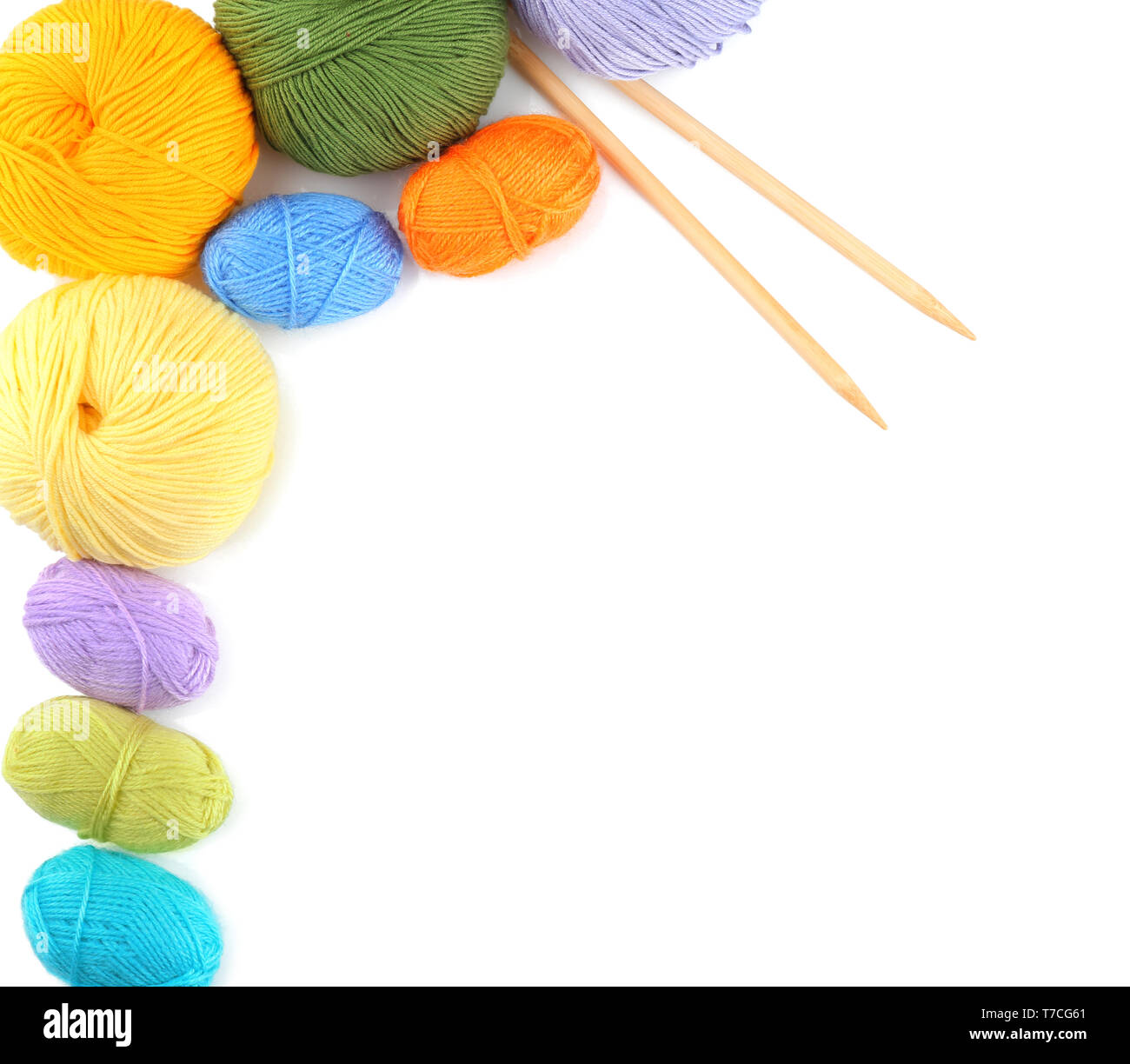 Knitting yarn with needles on white background Stock Photo - Alamy
